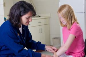 caregiver helping the wounded child